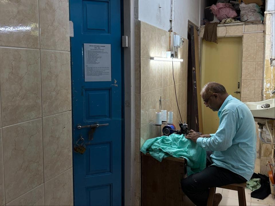 A tailor at work in Mumbai, India.