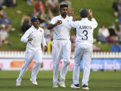 India's Ravichandran Ashwin, center, celebrates his dismissal of New Zealand's Henry Nicholls for 17 during the first cricket test between India and New Zealand at the Basin Reserve in Wellington, New Zealand, Saturday, Feb. 22, 2020. (AP Photo/Ross Setford)