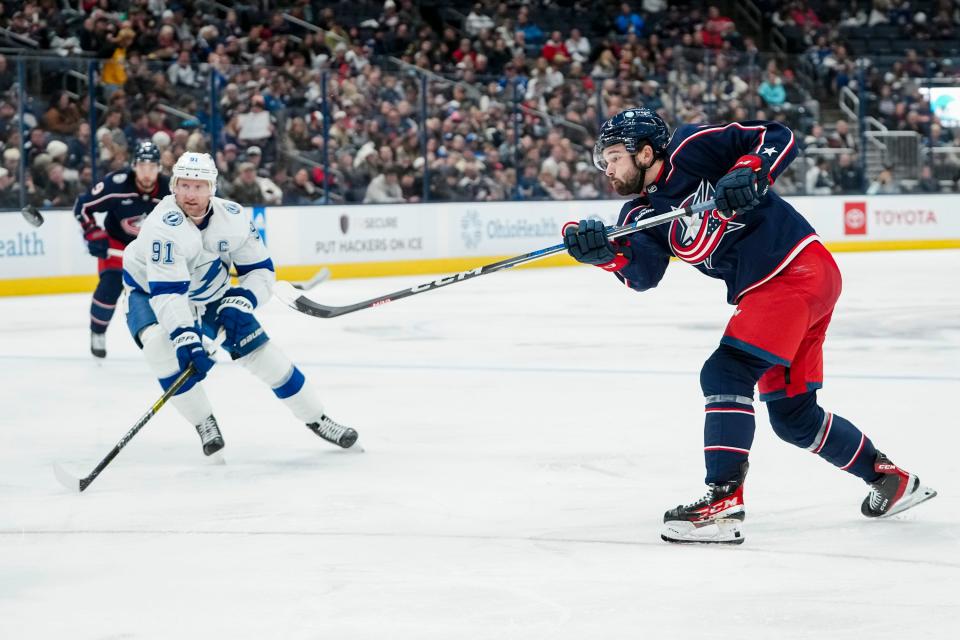 Nov 1, 2023; Columbus, Ohio, USA; Columbus Blue Jackets right wing Emil Bemstrom (52) takes a shot past Tampa Bay Lightning center Steven Stamkos (91) during the third period of the NHL hockey game at Nationwide Arena. The Blue Jackets won 4-2.