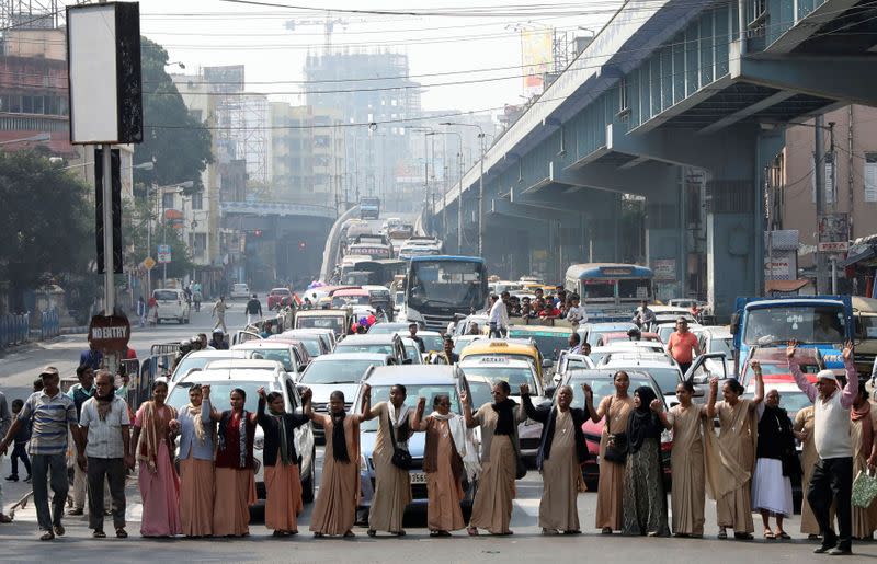 Demonstrators form a human chain after Republic Day celebrations to protest against a new citizenship law in Kolkata