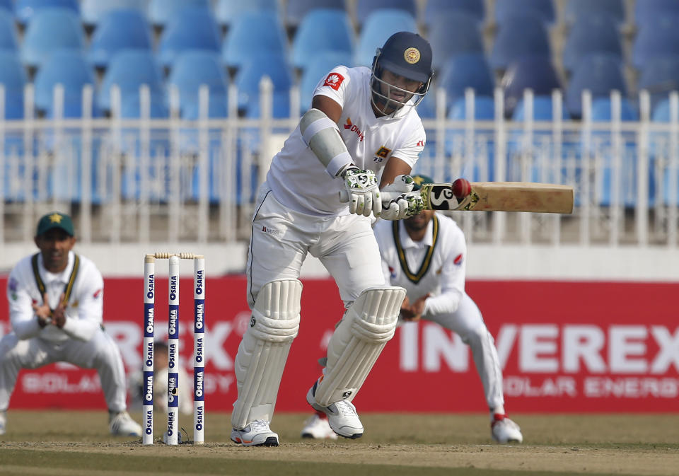 Sri Lankan batsman Dimuth Karunaratne plays a shot during the first-day of the 1st cricket test match between Pakistan and Sri Lanka, in Rawalpindi, Pakistan, Wednesday, Dec. 11, 2019. (AP Photo/Anjum Naveed)