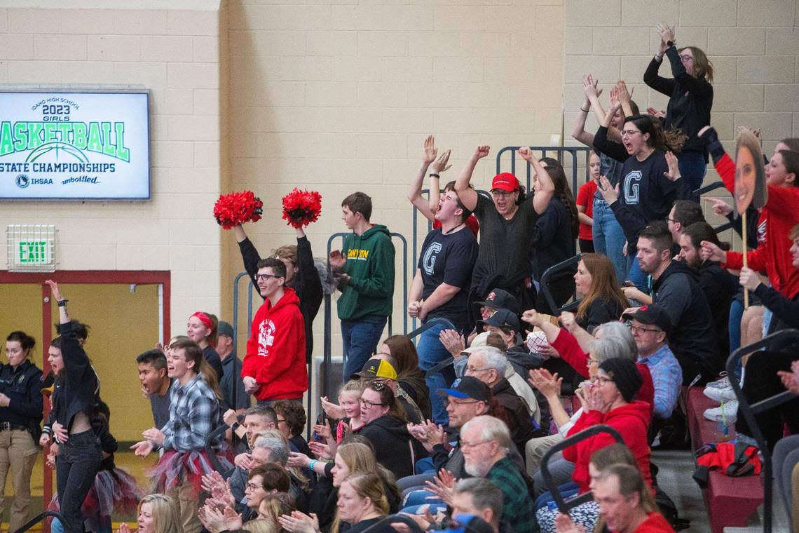 Greenleaf Friends Academy girls basketball fans react after the team scores at the 1A DI Girls Basketball State Championships quarterfinals game against Prairie on Thursday at Columbia High School. It was the first game the team played since the car crash Feb. 9 that killed coach Loma Bittick and hospitalized head coach Jim Bittick.