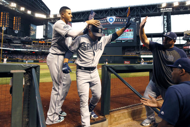 The San Diego Padres' Manny Machado is congratulated by teammate