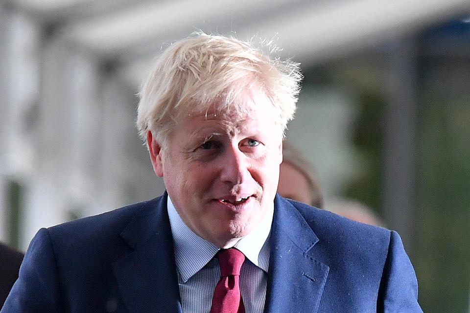 Britain's prime minister Boris Johnson returns to his hotel after giving media interviews on the third day of the Conservative Party conference in Manchester (Picture: AFP/Getty)