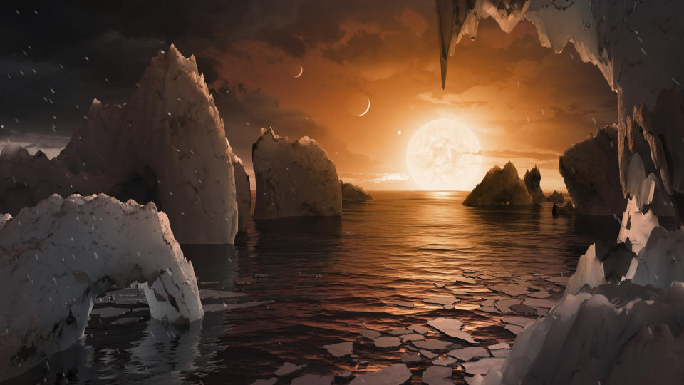 This image provided by NASA/JPL-Caltech shows an artist's conception of what the surface of the exoplanet TRAPPIST-1f may look like, based on available data about its diameter, mass and distances from the host star. The planets circle tightly around a dim dwarf star called Trappist-1, barely the size of Jupiter. Three are in the so-called habitable zone, where liquid water and, possibly life, might exist. The others are right on the doorstep. (NASA/JPL-Caltech via AP)