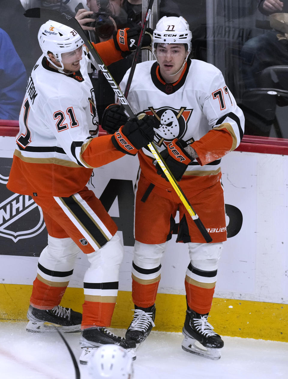 Anaheim Ducks center Isac Lundestrom, left, congratulates right wing Frank Vatrano, who scored against the Colorado Avalanche during the first period of an NHL hockey game Thursday, Jan. 26, 2023, in Denver. (AP Photo/David Zalubowski)