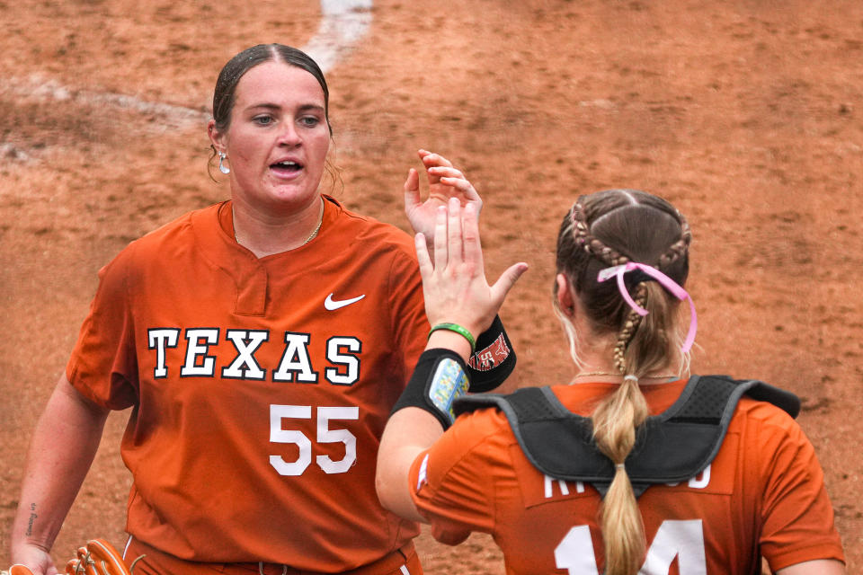 Texas pitcher Mac Morgan high-fives catcher Reese Atwood during last year's NCAA Regional win over Texas A&M at McCombs Field. Morgan was Texas' top pitcher last year, but the Longhorns' 2024 staff runs five pitchers deep.