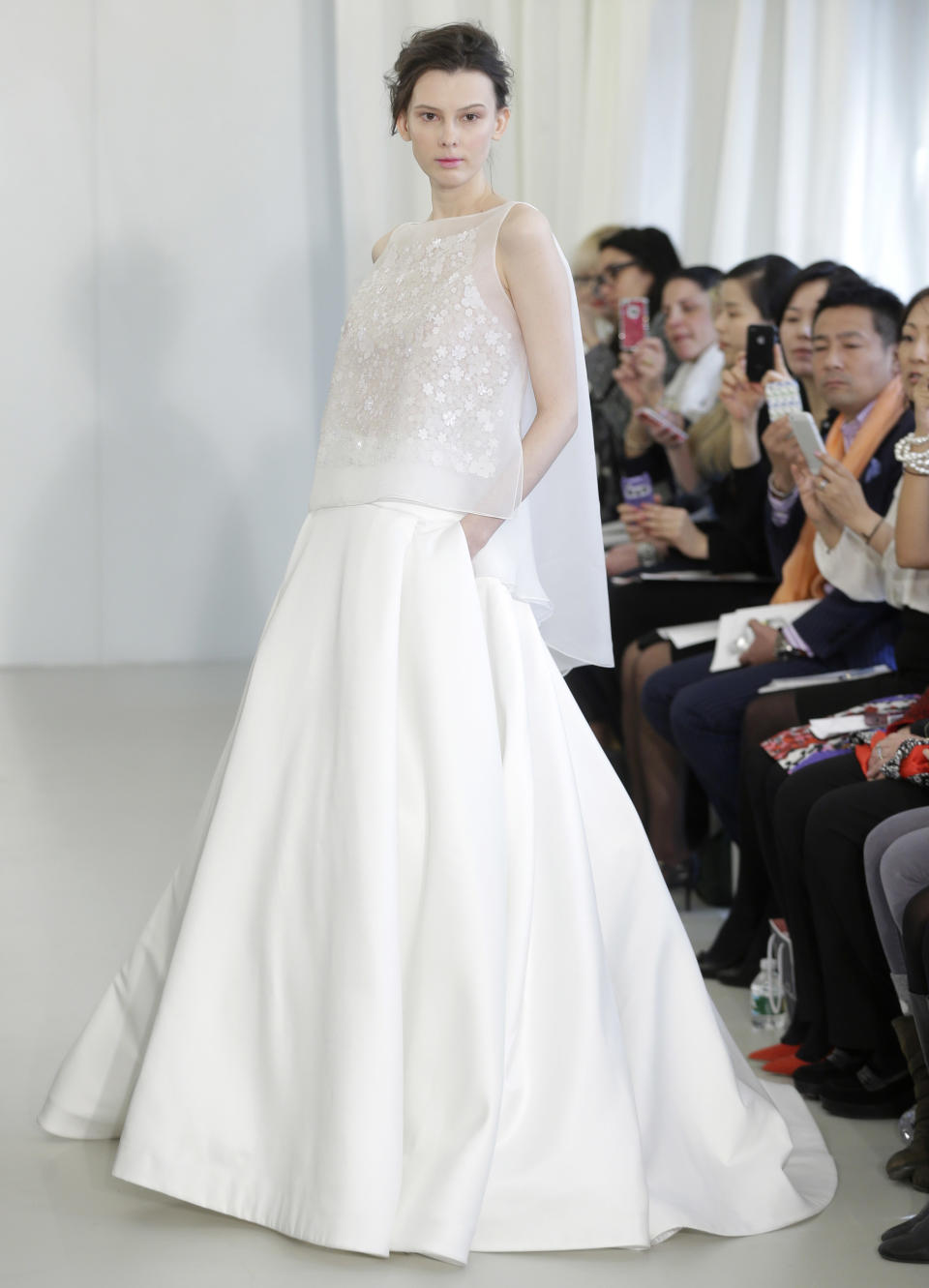 A bridal collection by Angel Sanchez is modeled in New York, Monday, April 22, 2013. (AP Photo/Seth Wenig)