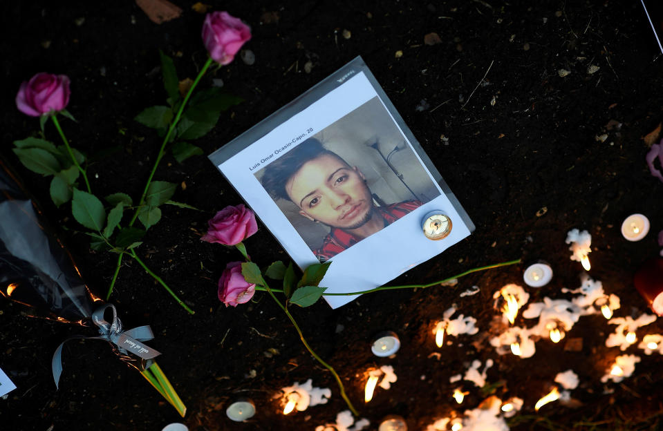 <p>Candles and flowers are left beside a photo of a victim of the gay nightclub mass shooting in Orlando, at St Anne’s Church in the Soho district of London, Britain June 13, 2016. REUTERS/Dylan Martinez </p>