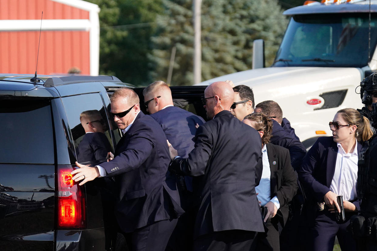 Secret Service Members assist Donald Trump into car Jabin Botsford/The Washington Post via Getty Images