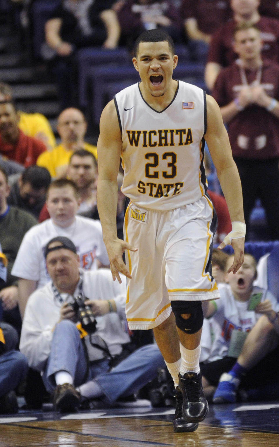 Wichita State's Fred VanVleet (23) celebrates a basket against Missouri State in the first half of an NCAA college basketball game in the semifinals of the Missouri Valley Conference men's tournament, Saturday, March 8, 2014, in St. Louis. (AP Photo/Bill Boyce)