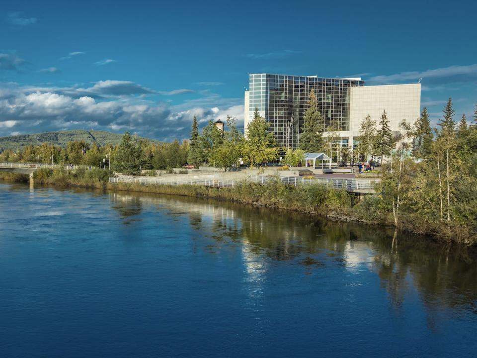 A view of Fairbanks Alaska with a river and white buildings