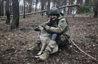 A Ukrainian serviceman take a rest on the frontline at an undisclosed location in the Donetsk region, Ukraine, Saturday, Nov. 26, 2022. (AP Photo/Roman Chop)