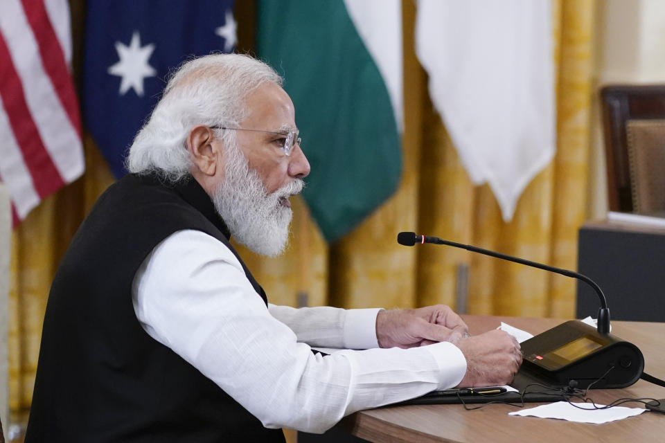 Indian Prime Minister Narendra Modi speaks during the Quad summit with President Joe Biden, Australian Prime Minister Scott Morrison and Japanese Prime Minister Yoshihide Suga in the East Room of the White House, Friday, Sept. 24, 2021, in Washington. (AP Photo/Evan Vucci)