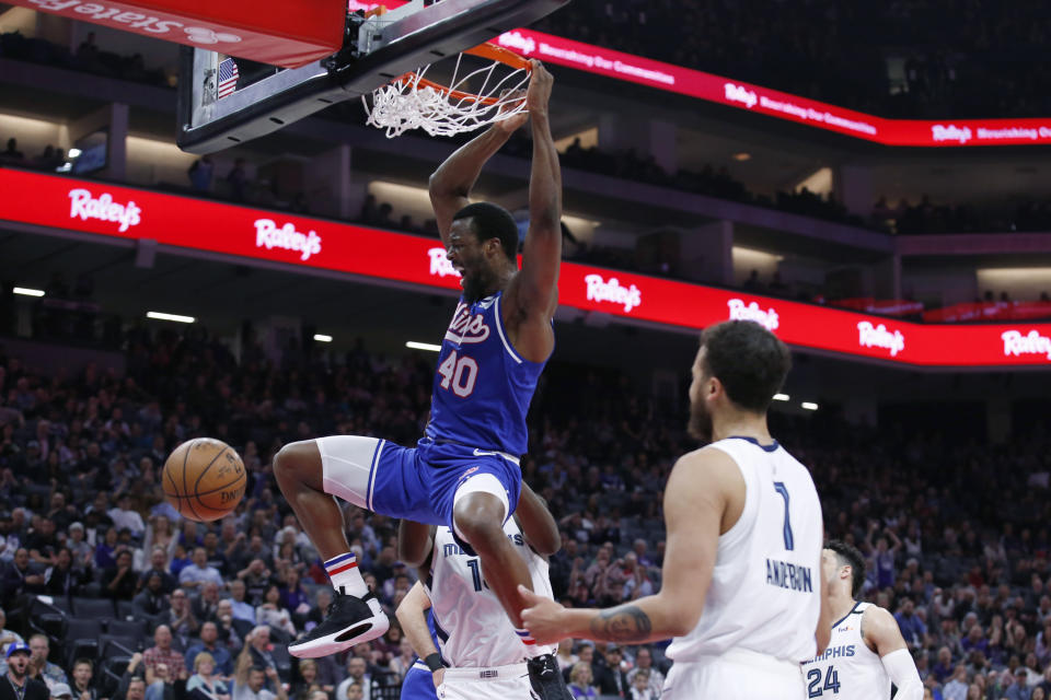 Sacramento Kings forward Harrison Barnes dunks as Memphis Grizzlies forward Kyle Anderson, right, watches during the first quarter of an NBA basketball game in Sacramento, Calif., Thursday, Feb. 20, 2020. (AP Photo/Rich Pedroncelli)