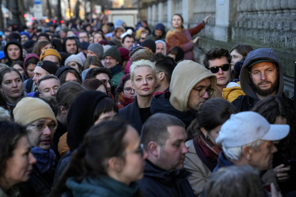 Yulia Navalnaya, center, widow of Alexey Navalny, stands in a queue with other voters at a polling station near the Russian embassy in Berlin, after noon local time, on Sunday, March 17, 2024. The Russian opposition has called on people to head to polling stations at noon on Sunday in protest as voting takes place on the last day of a presidential election that is all but certain to extend President Vladimir Putin's rule after he clamped down on dissent. AP can't confirm that all the voters seen at the polling station at noon were taking part in the opposition protest. (AP Photo/Ebrahim Noroozi)