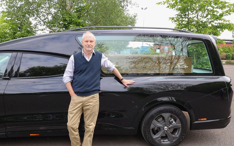 Jeremy Taylor trying out the EV hearse in Stratford-upon-Avon