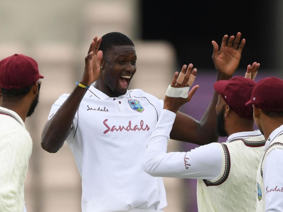 West Indies' Jason Holder celebrates taking the wicket of England's Jofra Archer: POOL/AFP via Getty Images