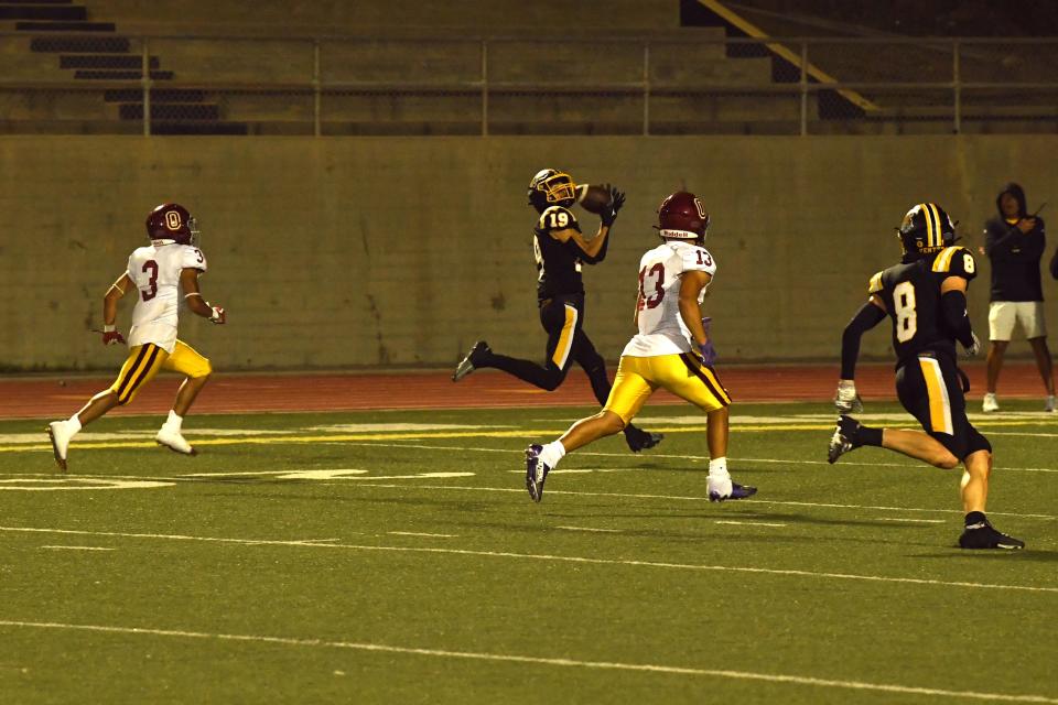 Ventura's Makana Arndt gets behind the Oxnard defense to make a catch during the Cougars' 35-0 win in a nonleague game at Ventura High on Friday, Sept. 1, 2023. The game marked the 100th anniversary of the programs' first meeting and the 99th game overall.