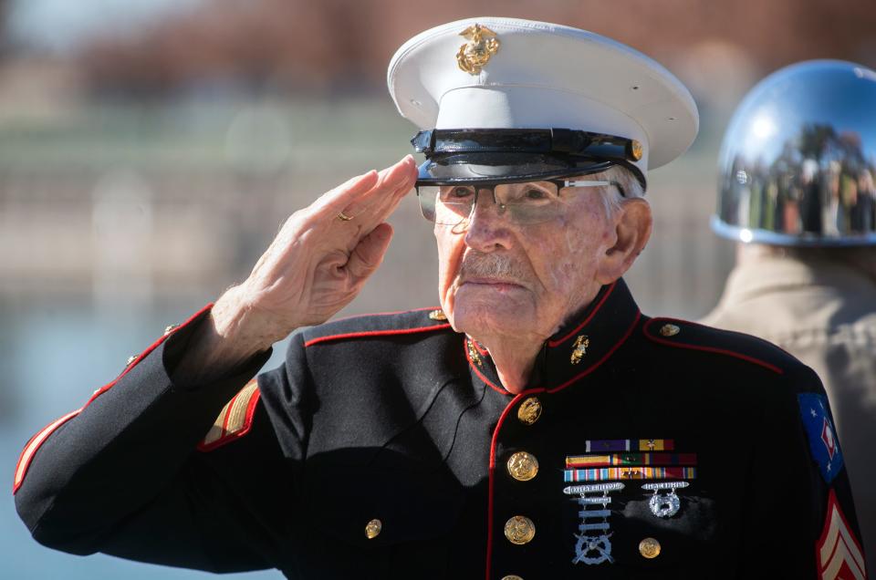 WWII veteran 97-year-old Frank Wright salutes at the Pearl Harbor Day observance at McLeod Lake Park in downtown Stockton on Wednesday, Dec. 7, 2022. 