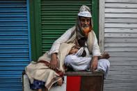 Demonstrators rest during a protest against a new citizenship law in Kolkata