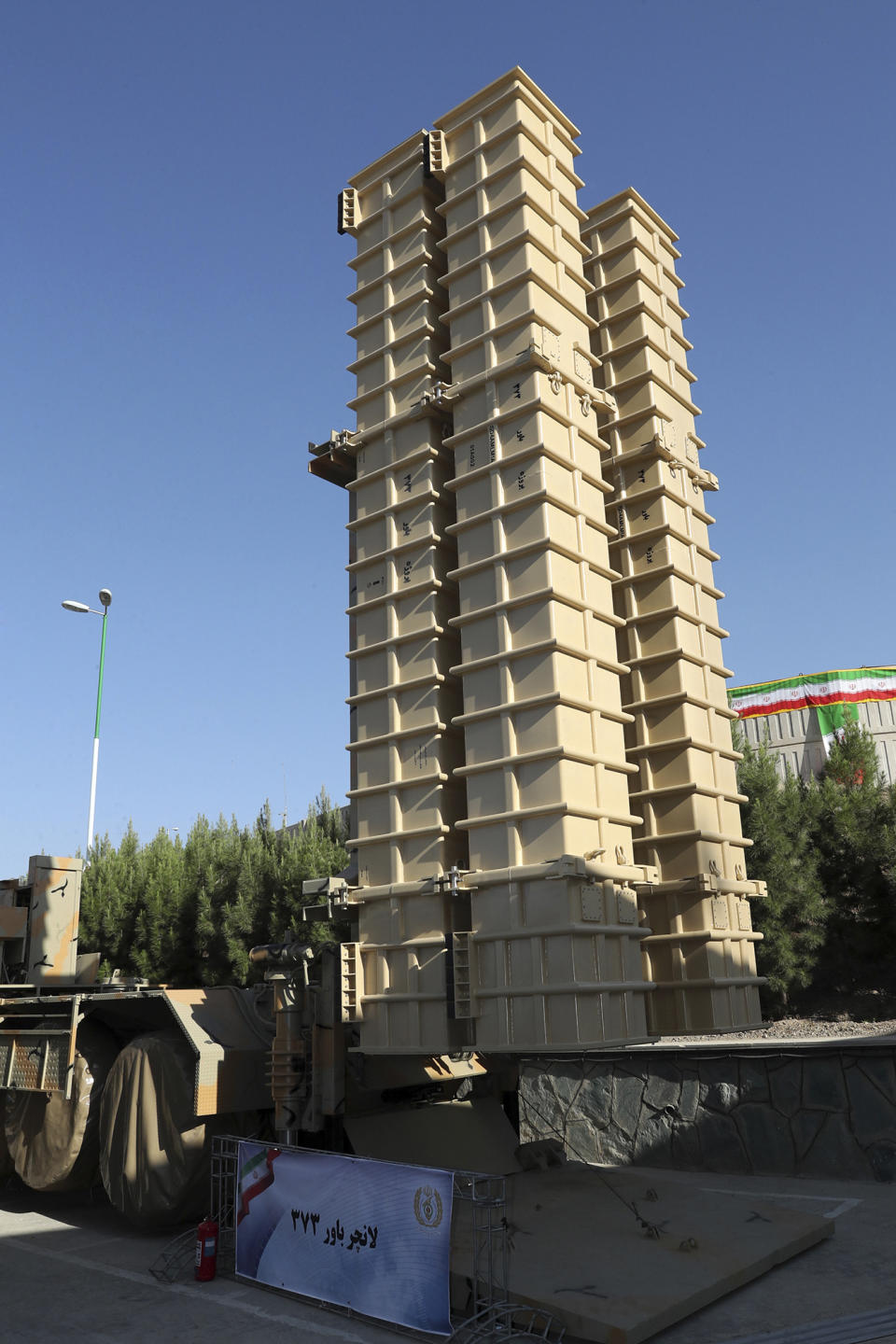 In this photo released by the official website of the office of the Iranian Presidency, a launcher of Iran-made Bavar-373 air-defense missile system is photographed in a ceremony unveiled by President Hassan Rouhani, Iran, Thursday, Aug. 22, 2019. Iran says the Bavar-373 is a long-range surface-to-air missile system able to recognize up to 100 targets at a same time and confront them with six different weapons. (Iranian Presidency Office via AP)