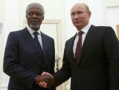 FILE - In this file photo taken on Tuesday, July 17, 2012, Russian President Vladimir Putin, right, shakes hands with United Nations special envoy Kofi Annan in Moscow, Russia. Putin says he admired former U.N. Secretary-General Kofi Annan whose death was announced on Saturday for his wisdom and courage. Kofi Annan, one of the world's most celebrated diplomats and a charismatic symbol of the United Nations who rose through its ranks to become the first black African secretary-general, has died aged 80, according to an announcement by his foundation Saturday Aug. 18, 2018. (AP Photo/Alexander Zemlianichenko, File)