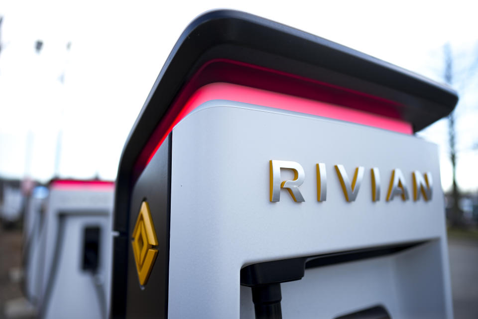 FILE- Rivian chargers sit Monday, March 4, 2024, in Charlotte, N.C. Shares of Rivian are soaring before the market open on Wednesday as Volkswagen has agreed to invest up to $5 billion in a new joint venture with the electric vehicle maker. Rivian's stock jumped more than 33% in premarket trading. (AP Photo/Chris Carlson, File)