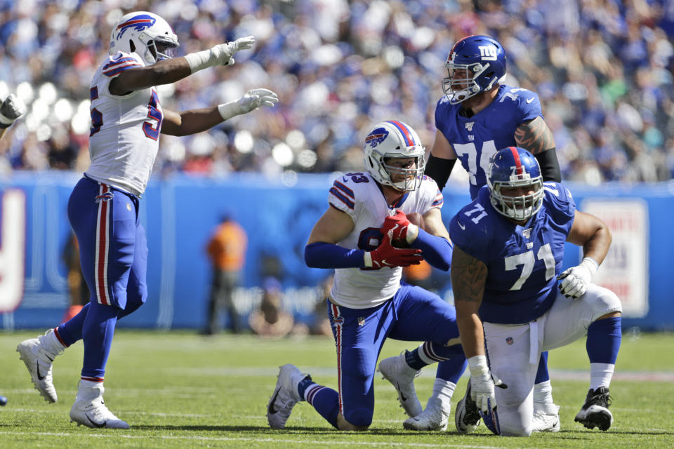 Buffalo Bills' Trent Murphy, second from left, reacts after an interception during the first half of an NFL football game against the New York Giants, Sunday, Sept. 15, 2019, in East Rutherford, N.J. (AP Photo/Adam Hunger)