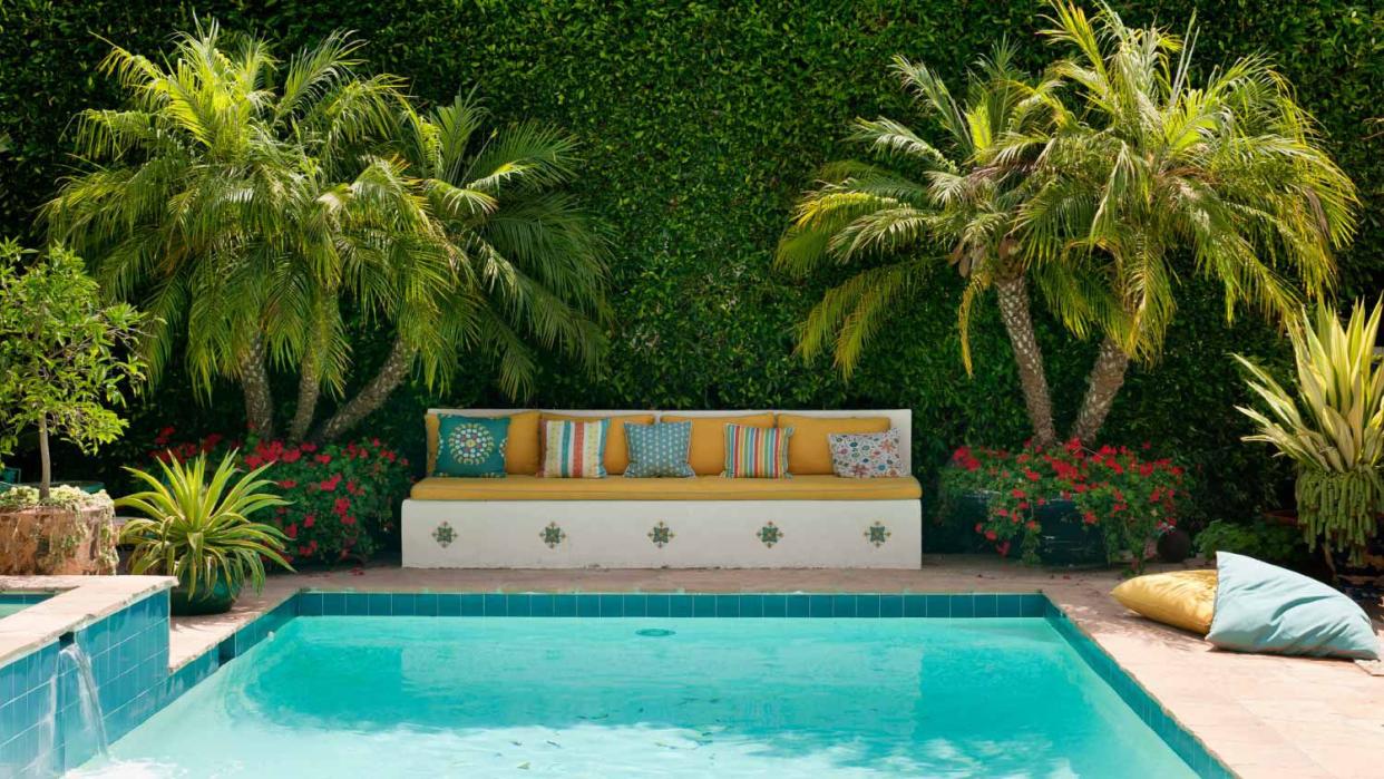 An outdoor pool in a suburban californian garden