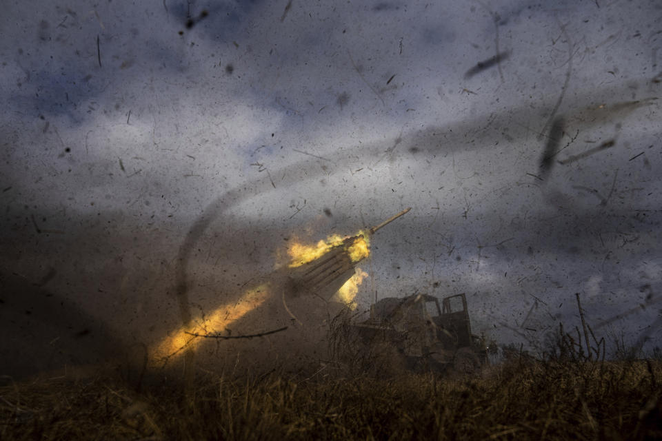 A Ukrainian MSLR BM-21 "Grad" rocket launcher of the 95 Air Assault brigade fires towards Russian positions at the frontline near Kreminna, Ukraine, Thursday, March 9, 2023. (AP Photo/Evgeniy Maloletka)