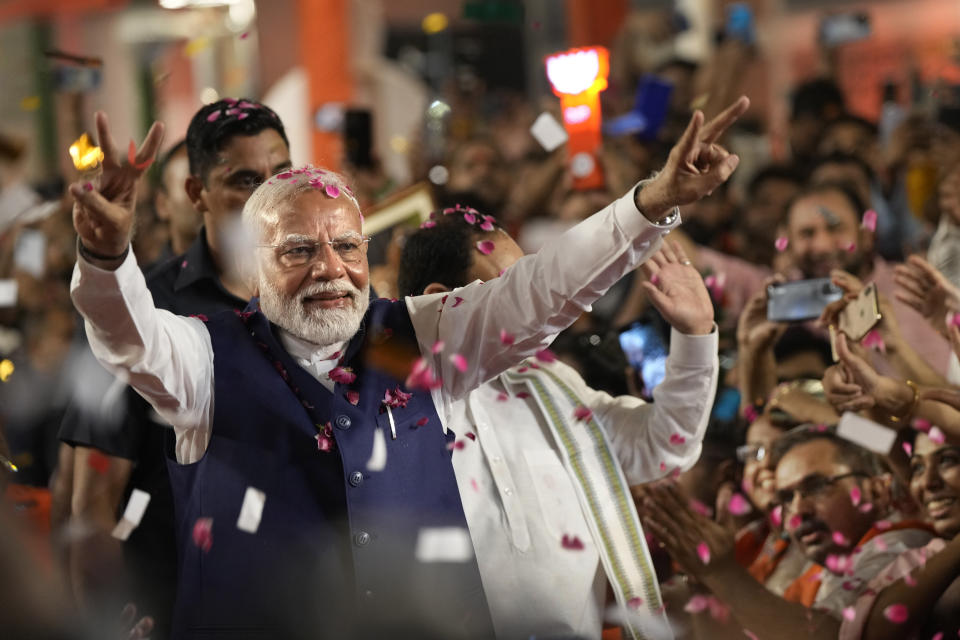 Indian Prime Minister Narendra Modi greets supporters as he arrives at Bharatiya Janata Party (BJP) headquarters after the election results were announced, in New Delhi, India, June 4, 2024. PM Modi on Friday was formally elected as the leader of the National Democratic Alliance coalition, which won the most number of seats in the country’s national election after his political party failed to win a majority on its own.(AP Photo/Manish Swarup)