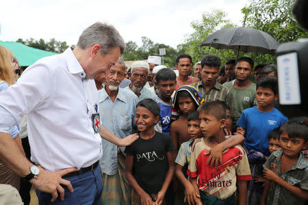 Peter Maurer, president of the International Committee of the Red Cross (ICRC), interacts with Rohingya children during his visit to a refugee camp in Cox's Bazar, Bangladesh, July 1, 2018. REUTERS/Mohammad Ponir Hossain