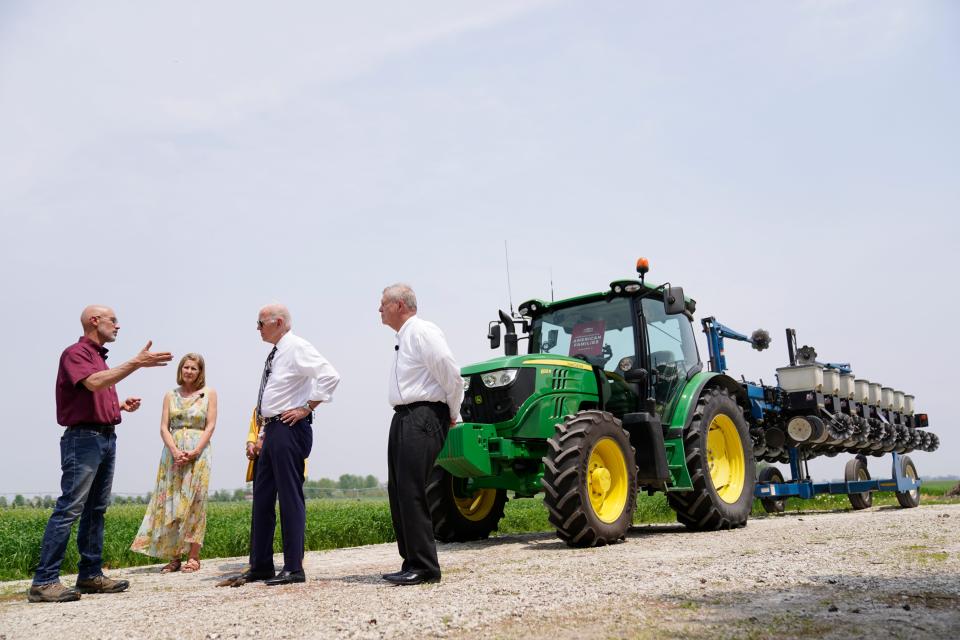 President Joe Biden and Agriculture Secretary Tom Vilsack visit O'Connor Farms owners Jeff, left, and Gina O'Connor on May 11 in Kankakee, Ill.