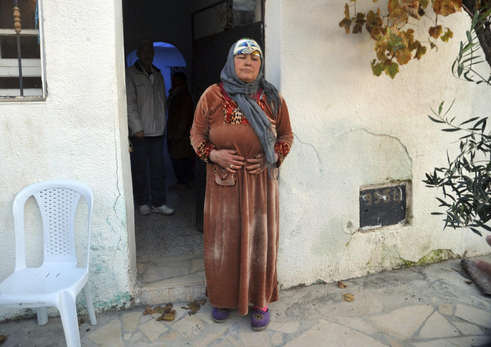 Nour El Houda Hassani, the mother of Anis Amri, reacts after the death of her son in Oueslatia, central Tunisia, Friday, Dec. 23, 2016. Anis Amri, the Tunisian-born suspect in the Berlin truck rampage that killed at least 12, was shot dead early Friday on the outskirts of Milan, Italy. (AP Photo/Anis Ben Salah)