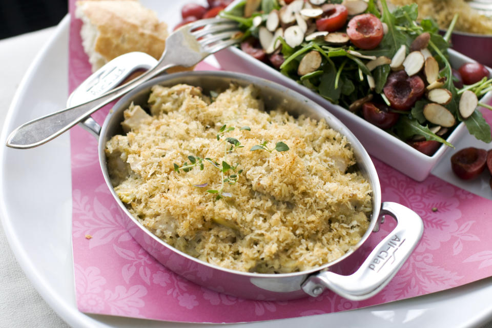 In this image taken on Jan. 21, 2013, crab and hearts of palm gratin with arugula and cherry salad are shown in Concord, N.H. (AP Photo/Matthew Mead)