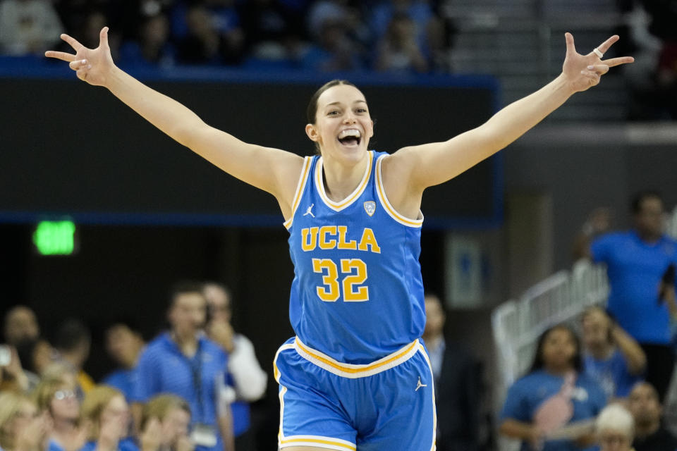 UCLA forward Angela Dugalic (32) celebrates after making a 3-point basket during the first half of the team's NCAA college basketball game against Southern California, Saturday, Dec. 30, 2023, in Los Angeles. (AP Photo/Marcio Jose Sanchez)