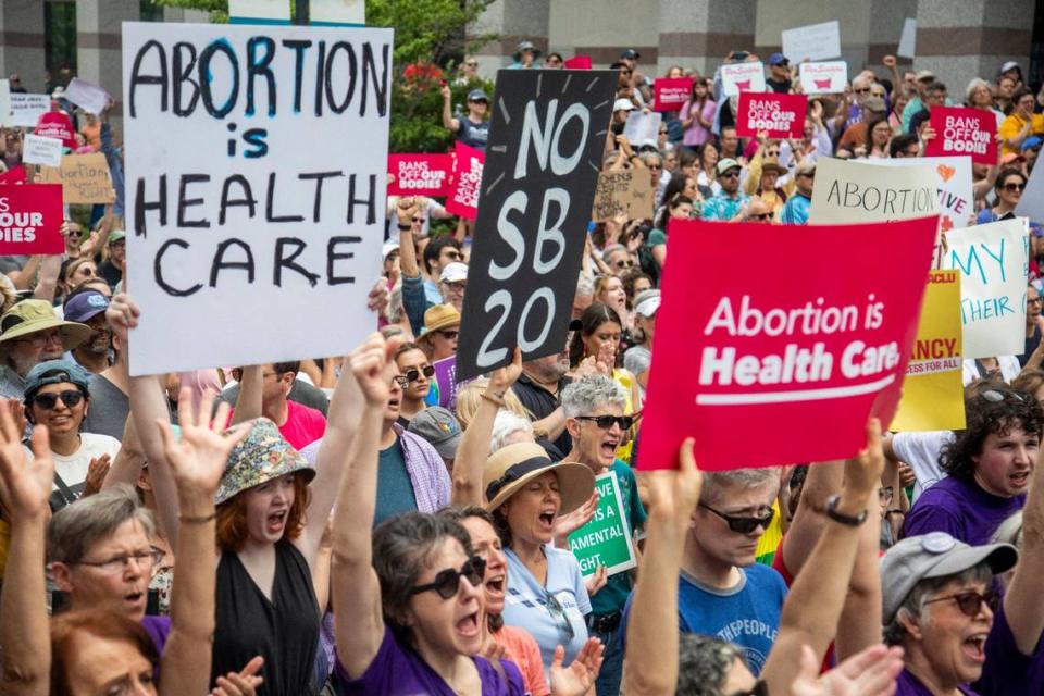 Hundreds of abortion ban veto supporters turned out to watch Gov. Roy Cooper sign a veto of the on Bicentennial Mall in Raleigh Saturday, May 19, 2023.