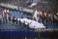 <p>Hosting over 60,000 people, the Olympic Stadium in Grenoble was only used for the Games and disassembled immmediately after. The torch was lit by 1964 silver medalist Alain Calmat.</p>