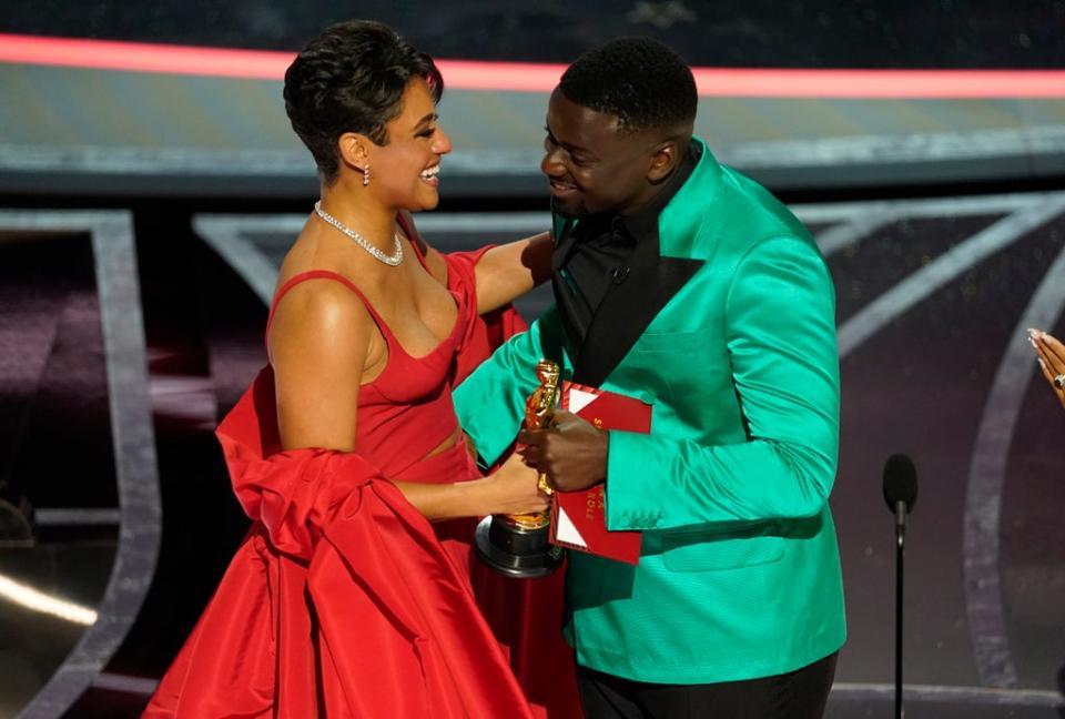 Ariana DeBose collects her gong from Daniel Kaluuya (Chris Pizzello/AP) (AP)