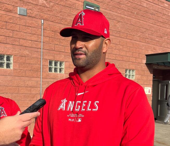 Albert Pujols speaks with reporters at Angels camp on Monday, March 4, 2024, in Tempe, Ariz.