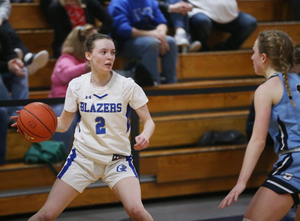 Millbrook's Hannah Ross is covered by Pine Plains' Michelle Blackburn during the Section 9 Class C girls basketball championship on February 28, 2024.