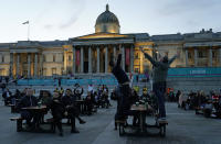 England supporters react after a goal was scored that was later disallowed in the fan zone in Trafalgar Square in London, Tuesday, June 22, 2021 during the Euro 2020 soccer championship group D match between England and the Czech Republic at Wembley Stadium. (AP Photo/Alberto Pezzali)