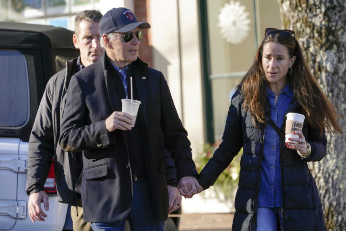 President Joe Biden holds hands with his daughter Ashley Biden as they walk by shops in Nantucket, Mass., Saturday, Nov. 26, 2022. (AP Photo/Susan Walsh)