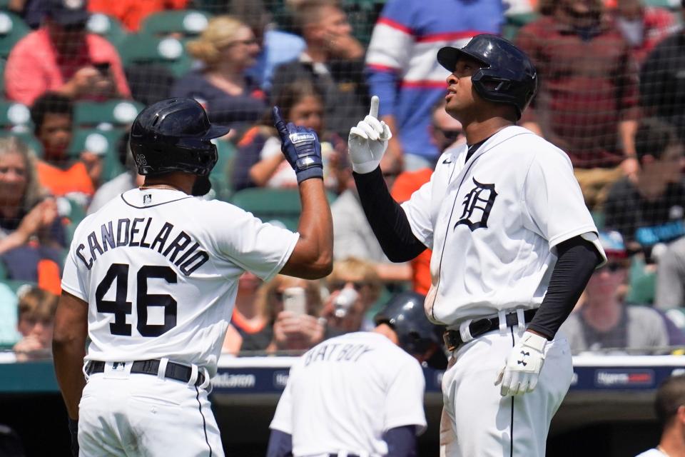 Detroit Tigers' Jonathan Schoop, right, celebrates his solo home run with Jeimer Candelario (46) in the fifth inning of a baseball game against the St. Louis Cardinals in Detroit, Wednesday, June 23, 2021.