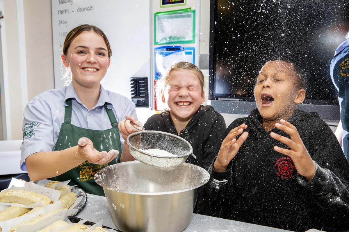 Schoolchildren get a lesson in making sausage rolls from Drake & Macefield <i>(Image: Stephen Garnett)</i>