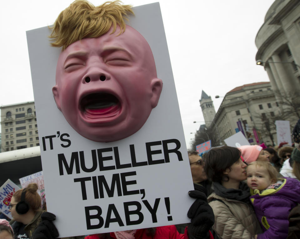 A group hold up signs at freedom plaza during the women’s march in Washington on Saturday, Jan. 19, 2019. (Photo/Jose Luis Magana/AP)