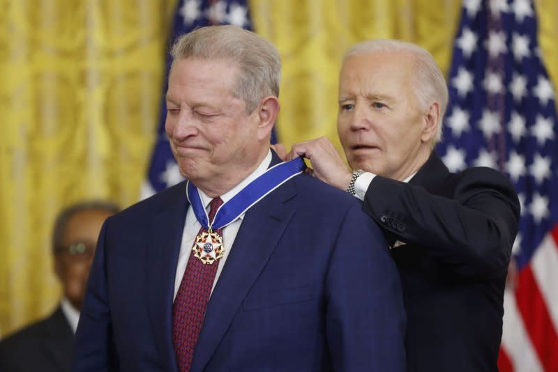 President Joe Biden presents former Vice President Al Gore (L) with the Presidential Medal of Freedom, the nation's highest civilian honor, during a ceremony in the East Room of the White House in Washington on Friday. Photo by Jonathan Ernst/UPI