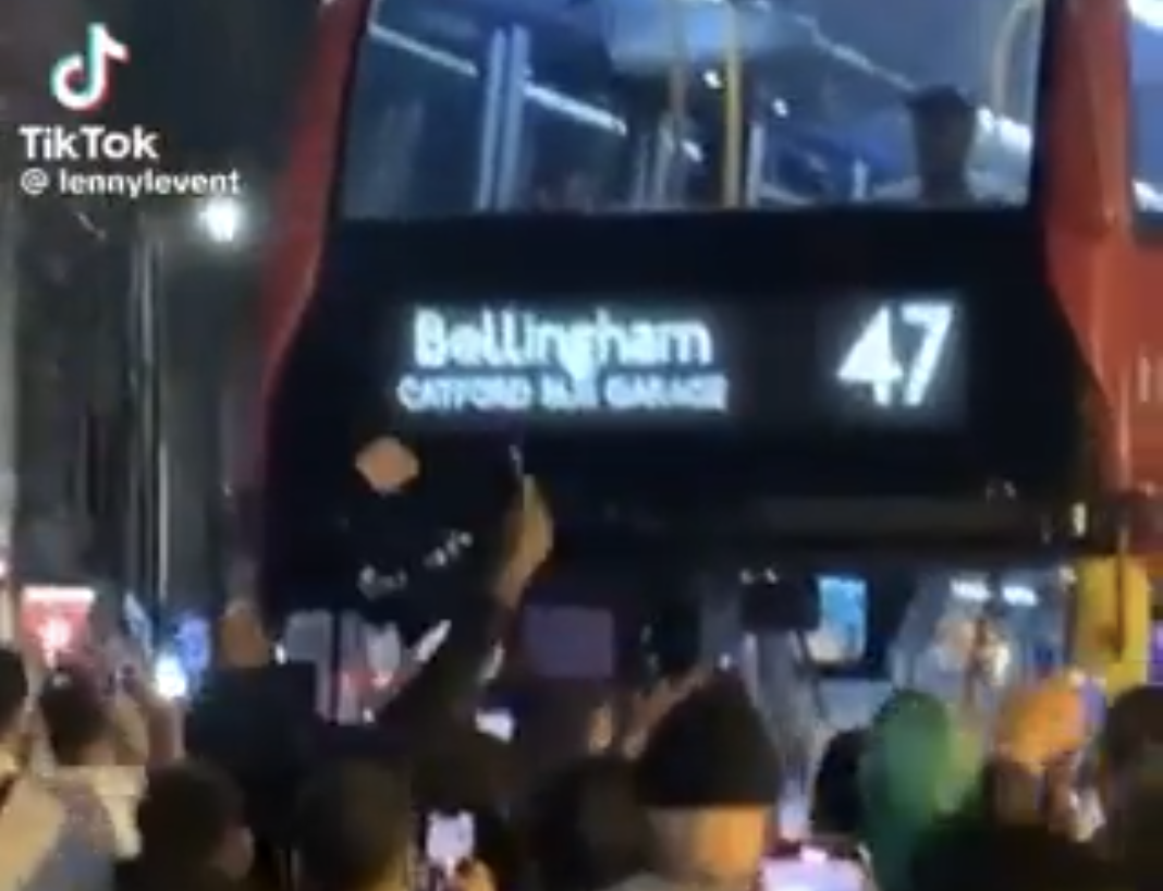 England fans gather around a Bellingham bus in south-east London. (X)