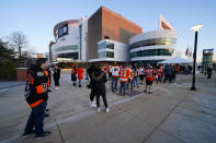 Fans line up outside the Wells Fargo Center before an NHL hockey game between the Philadelphia Flyers and the Washington Capitals, Sunday, March 7, 2021, in Philadelphia. (AP Photo/Matt Slocum)